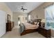 Comfortable primary bedroom with carpet, ceiling fan and natural light at 821 Shallow Brook Ave, Winter Springs, FL 32708