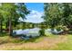 Pond surrounded by lush greenery, featuring a serene, tranquil view at 821 Shallow Brook Ave, Winter Springs, FL 32708