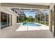 Screened-in pool area with an in-ground pool, white tiling and a covered patio that is perfect for outdoor relaxation at 821 Shallow Brook Ave, Winter Springs, FL 32708