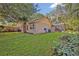 Home exterior with grassy backyard and fenced area leading to patio at 828 Timber Court Ct, Apopka, FL 32712