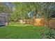 Expansive backyard featuring a well-kept lawn and a tall wooden privacy fence at 828 Timber Court Ct, Apopka, FL 32712