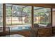 Views from inside the porch to the screened-in pool and fenced in yard at 828 Timber Court Ct, Apopka, FL 32712