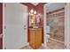 Bathroom featuring walk-in shower with tile surround, vanity and vessel sink at 828 Timber Court Ct, Apopka, FL 32712