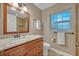 Bathroom featuring granite countertop, vanity, and neutral color palette at 828 Timber Court Ct, Apopka, FL 32712