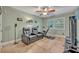 Bedroom features exercise equipment, tile floors, and a window with shutters at 828 Timber Court Ct, Apopka, FL 32712