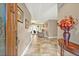 Welcoming tiled foyer with decorative table, chandelier, and neutral decor at 828 Timber Court Ct, Apopka, FL 32712