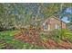 Beautiful brick home with lush landscaping, palm trees, and green lawn at 828 Timber Court Ct, Apopka, FL 32712