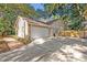 Spacious two-car garage with a brick pathway to the home and yard at 828 Timber Court Ct, Apopka, FL 32712
