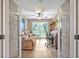 Bright office with a sofa, natural light, and French doors for privacy at 828 Timber Court Ct, Apopka, FL 32712