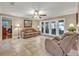Cozy living room with tile flooring, ceiling fan, and plenty of natural light at 828 Timber Court Ct, Apopka, FL 32712