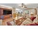 Cozy living room with built-in entertainment center and fireplace at 828 Timber Court Ct, Apopka, FL 32712