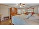 Comfortable main bedroom featuring a decorative border, ceiling fan, and ensuite bathroom at 828 Timber Court Ct, Apopka, FL 32712