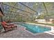 Enclosed pool with lounge chairs and outdoor space at 828 Timber Court Ct, Apopka, FL 32712