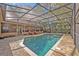 View of the pool and patio with seating area, perfect for relaxation and entertaining at 828 Timber Court Ct, Apopka, FL 32712