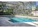 Inviting screened pool featuring brick pavers, perfect for outdoor relaxation and entertaining at 828 Timber Court Ct, Apopka, FL 32712