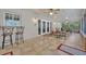 The screened porch features tile flooring and ceiling fans providing a relaxing outdoor living space at 828 Timber Court Ct, Apopka, FL 32712