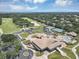 Aerial view of clubhouse featuring community pool, tennis courts, putting green, and parking at 8430 Woburn Ct, Windermere, FL 34786
