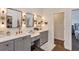 This bathroom boasts dual sinks, modern lighting, and access to a walk-in closet at 8430 Woburn Ct, Windermere, FL 34786