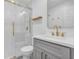 Stylish bathroom featuring a glass shower, vanity with gold hardware and white countertop at 8430 Woburn Ct, Windermere, FL 34786