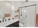 Modern bathroom with a glass-enclosed shower, sleek vanity, and matte black hardware at 8430 Woburn Ct, Windermere, FL 34786