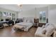Tranquil bedroom featuring a comfortable seating area and large windows with great natural light at 8430 Woburn Ct, Windermere, FL 34786