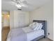 Cozy bedroom featuring a comfortable bed, and convenient access to the bathroom and hallway at 8430 Woburn Ct, Windermere, FL 34786