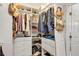 Walk-in closet with custom shelving and organization solutions for clothes, shoes, and accessories at 8430 Woburn Ct, Windermere, FL 34786