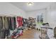 Spacious walk-in closet with custom shelving, ample storage, and natural lighting at 8430 Woburn Ct, Windermere, FL 34786