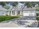 Charming home with a driveway and meticulously kept landscaping at 8430 Woburn Ct, Windermere, FL 34786
