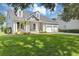 Beautiful home featuring manicured lawn and a two-car garage at 8430 Woburn Ct, Windermere, FL 34786