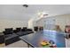 This large game room features a ping pong table, a cozy lounge area, and a ceiling fan at 8430 Woburn Ct, Windermere, FL 34786