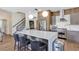Bright modern kitchen with a large island, stainless steel appliances, and pendant lighting at 8430 Woburn Ct, Windermere, FL 34786