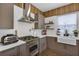 Stylish kitchen with stainless steel appliances, modern fixtures, and ample countertop space at 8430 Woburn Ct, Windermere, FL 34786