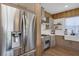 Bright kitchen featuring stainless steel appliances, custom cabinetry, and wood flooring at 8430 Woburn Ct, Windermere, FL 34786