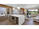 Open-concept kitchen and living room with modern furnishings and lake views at 8430 Woburn Ct, Windermere, FL 34786
