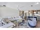Inviting living room with a modern kitchen, staircase, and plush seating arrangement at 8430 Woburn Ct, Windermere, FL 34786