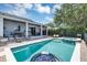 Inviting backyard pool area with a spa, patio, and outdoor seating, perfect for entertaining at 8430 Woburn Ct, Windermere, FL 34786