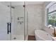 The bathroom showcases a glass-enclosed shower with a hand shower and rain head at 8430 Woburn Ct, Windermere, FL 34786