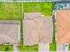An aerial view highlighting a home's tile roof, surrounding landscaping, and neighboring properties in a residential area at 8491 Pippen Dr, Orlando, FL 32836