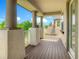 Inviting outdoor balcony featuring covered pillars with tropical landscaping in the background at 8491 Pippen Dr, Orlando, FL 32836