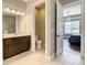 Spacious bathroom layout with a vanity and a bedroom view at 8491 Pippen Dr, Orlando, FL 32836