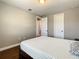 Bedroom showcasing hardwood floors, neutral walls, and a view to another room at 8491 Pippen Dr, Orlando, FL 32836