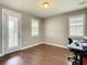 Bedroom featuring neutral walls, hardwood floors, and abundant natural light at 8491 Pippen Dr, Orlando, FL 32836