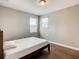 Sunlit bedroom features hardwood floors and a bright airy feel at 8491 Pippen Dr, Orlando, FL 32836
