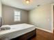 Comfortable bedroom with wood floors and a window providing plenty of natural light at 8491 Pippen Dr, Orlando, FL 32836