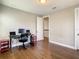Bedroom or office with hardwood floors and neutral paint at 8491 Pippen Dr, Orlando, FL 32836