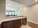 Bright bonus room with a snack bar, and an open view to the living room at 8491 Pippen Dr, Orlando, FL 32836