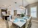 Open-concept dining room with a view of the kitchen and living areas, perfect for entertaining guests at 8491 Pippen Dr, Orlando, FL 32836
