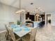 Open-concept dining room with a view of the modern kitchen, creating an inviting and connected living space at 8491 Pippen Dr, Orlando, FL 32836
