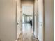 Hallway with marble floors that leads into the dining room at 8491 Pippen Dr, Orlando, FL 32836